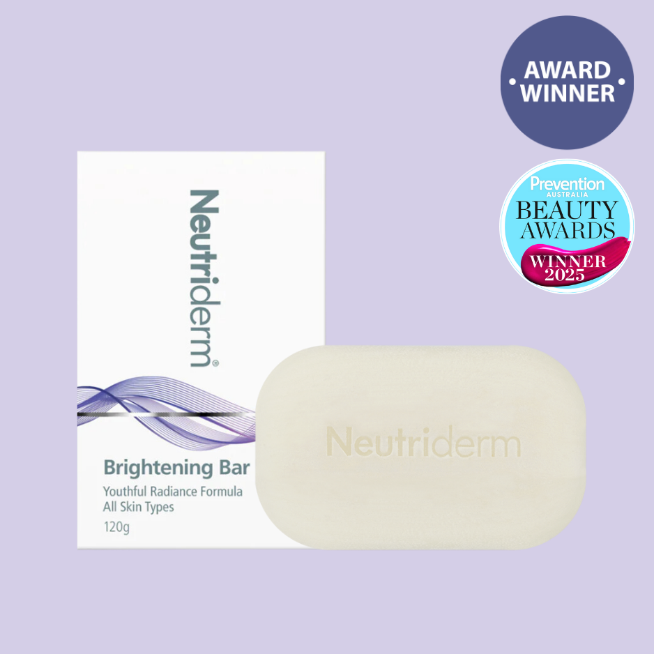 Neutriderm brightening bar with packaging on a purple background