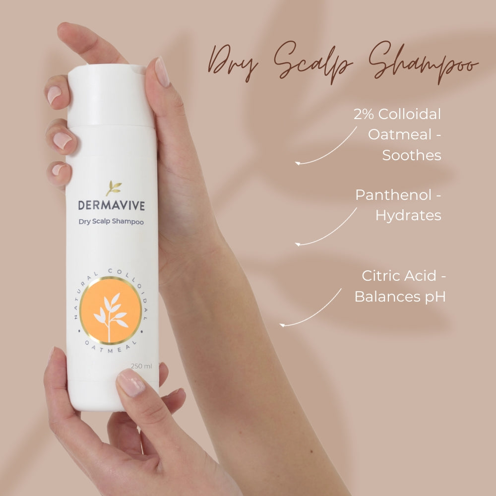 Hand holding a bottle of Dermavive Dry Scalp Shampoo with product features on a beige background
